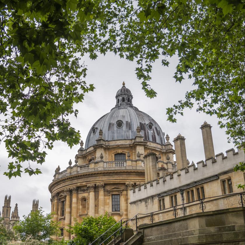 a building with a dome and trees.
