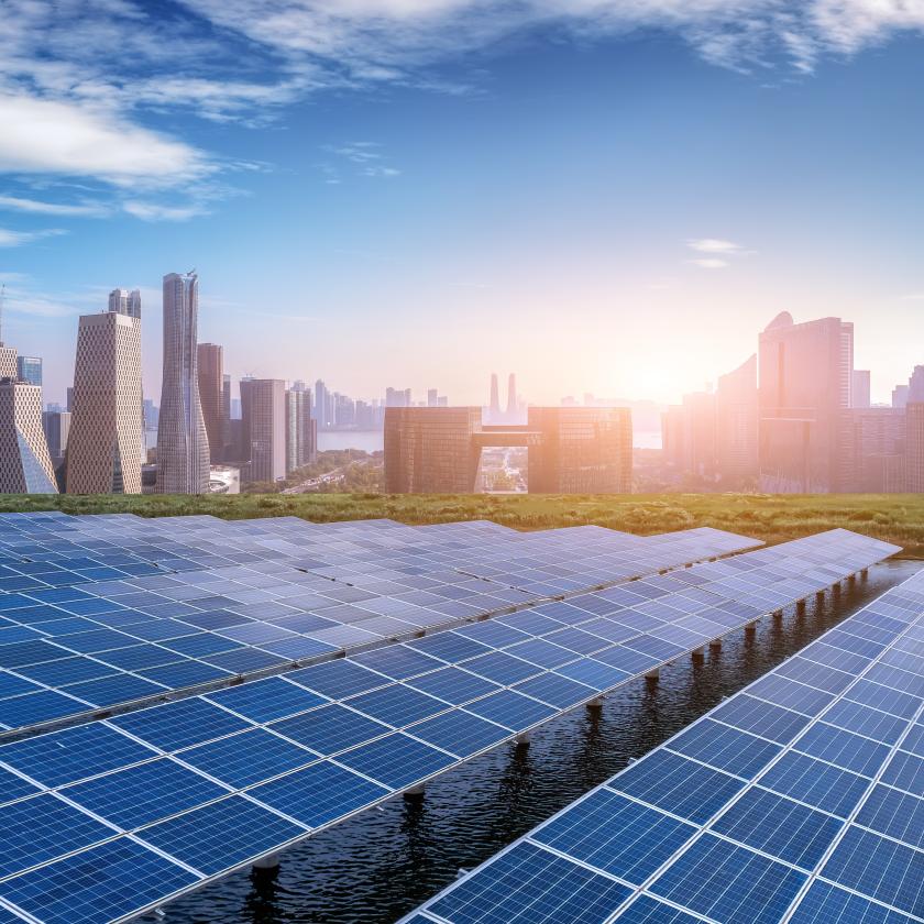 City skyline with solar panels in the foreground