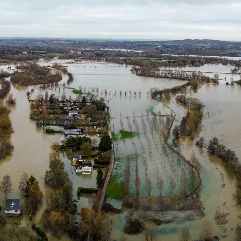 a flooded area with houses and trees