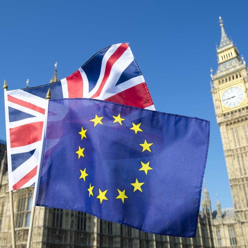 image of a Union Jack flag and EU flag in front of Big Ben and the Houses of Parliament in London