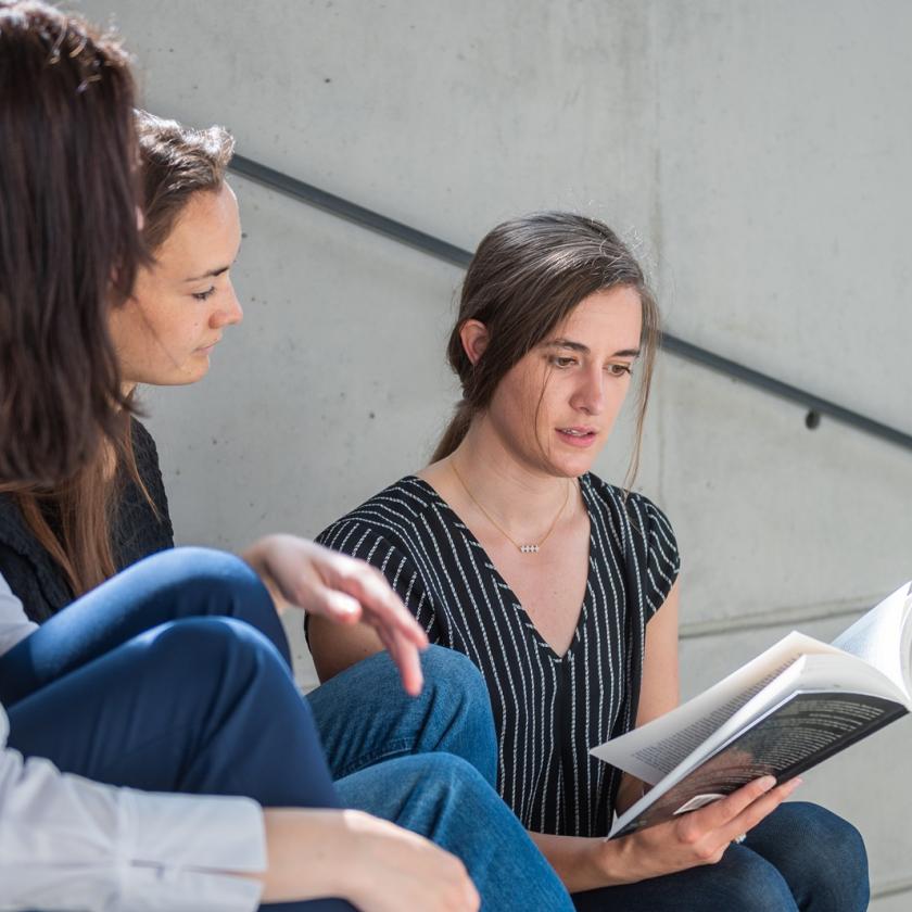 Female students sitting on stairs