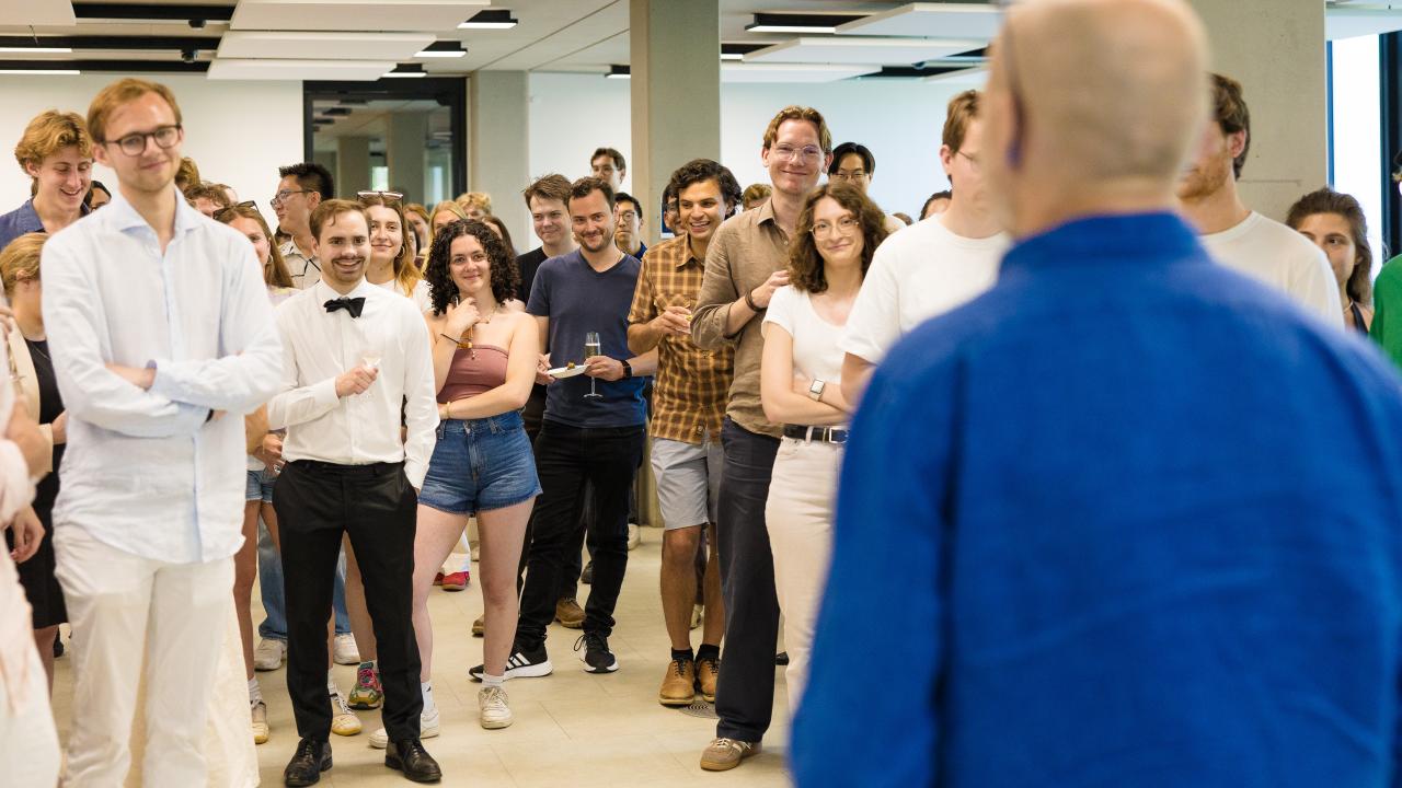 image of a man standing in front of a group of students