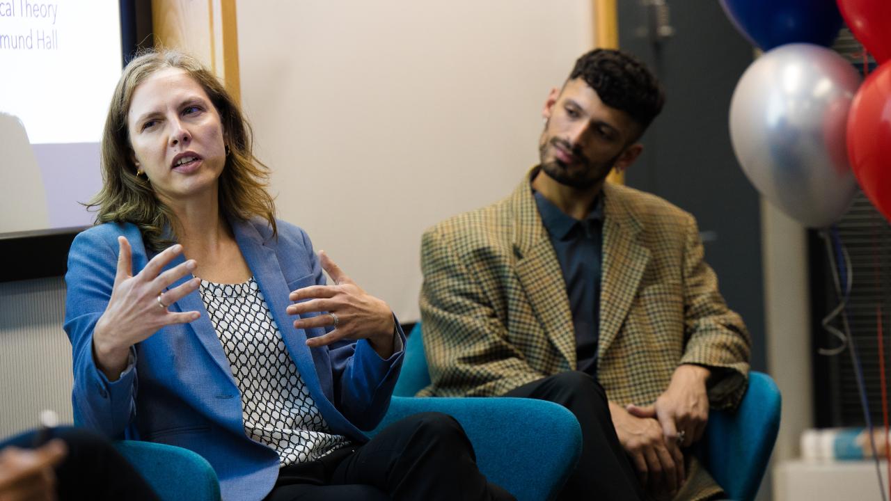 image of a man and woman seated next to one another