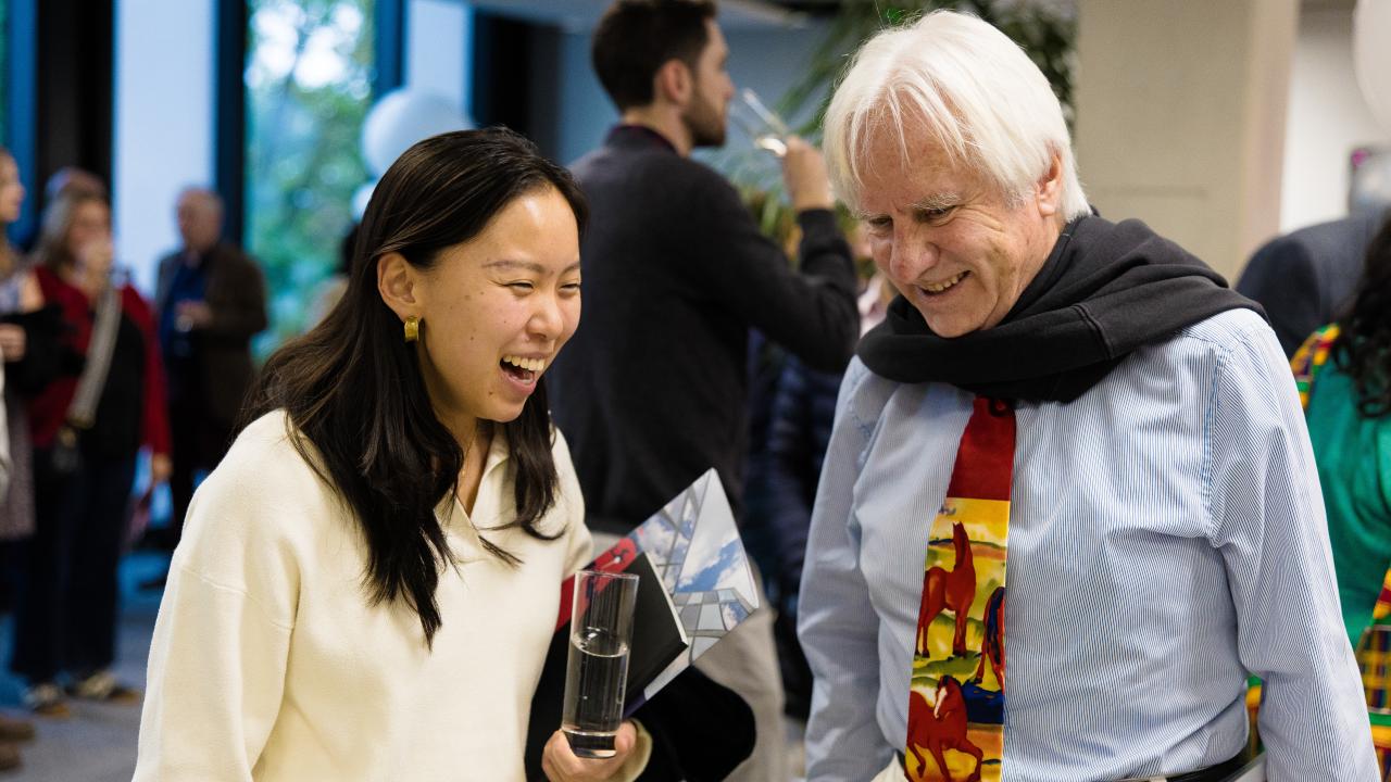 image of a woman laughing talking to a man