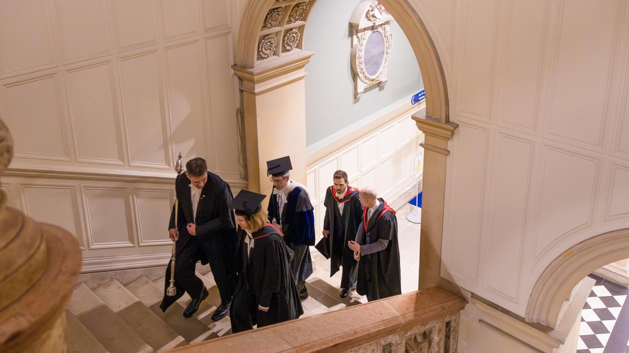 a group of people walking up a staircase