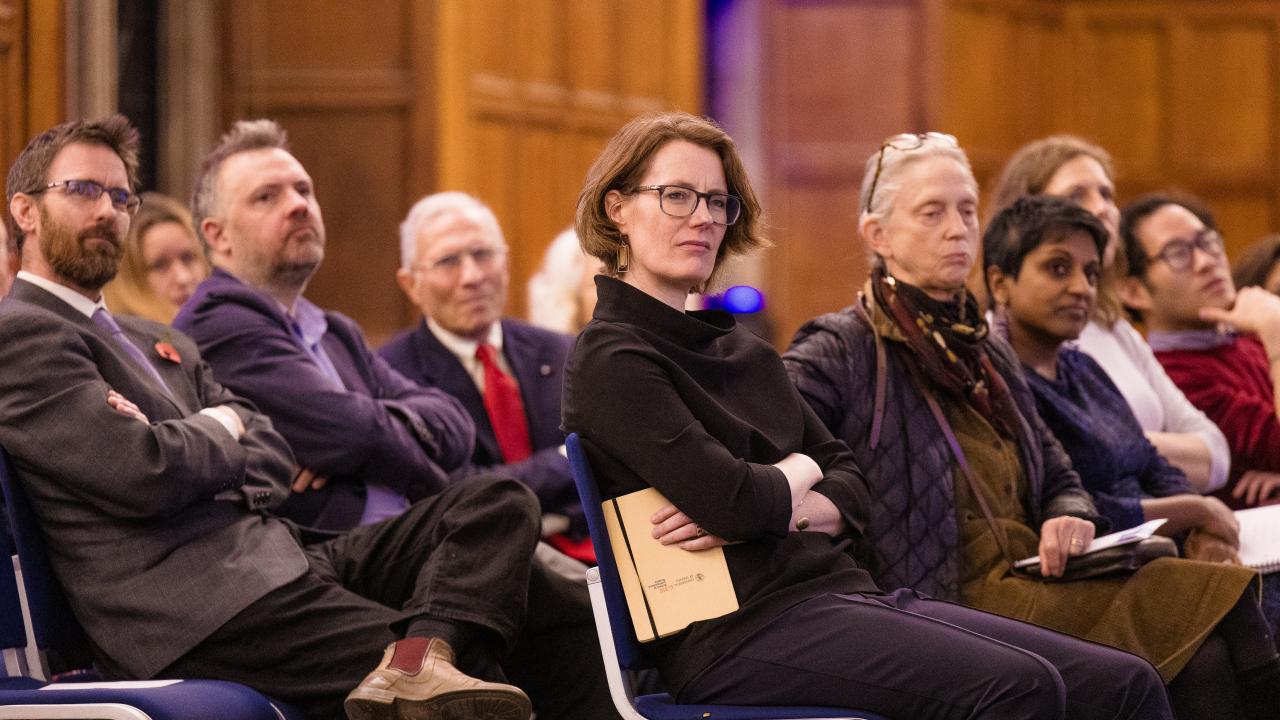 side image of an audience listening to a lecture