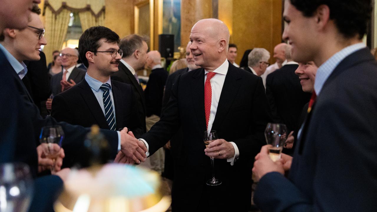 image of four people stood in a semi-circle talking