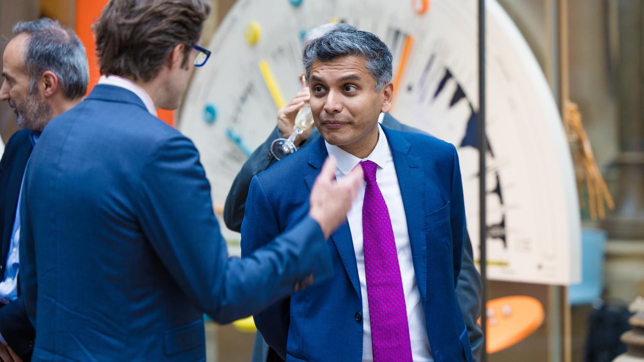 image of two men talking