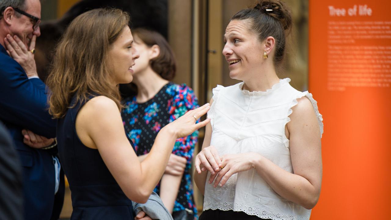 image of two women stood talking