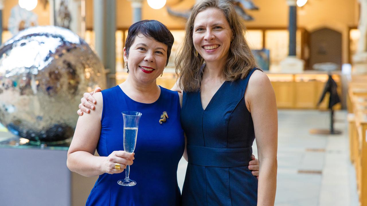 image of two women facing the camera, smiling