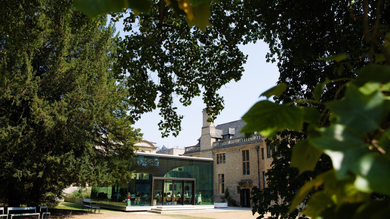 image of a building seen between a number of trees