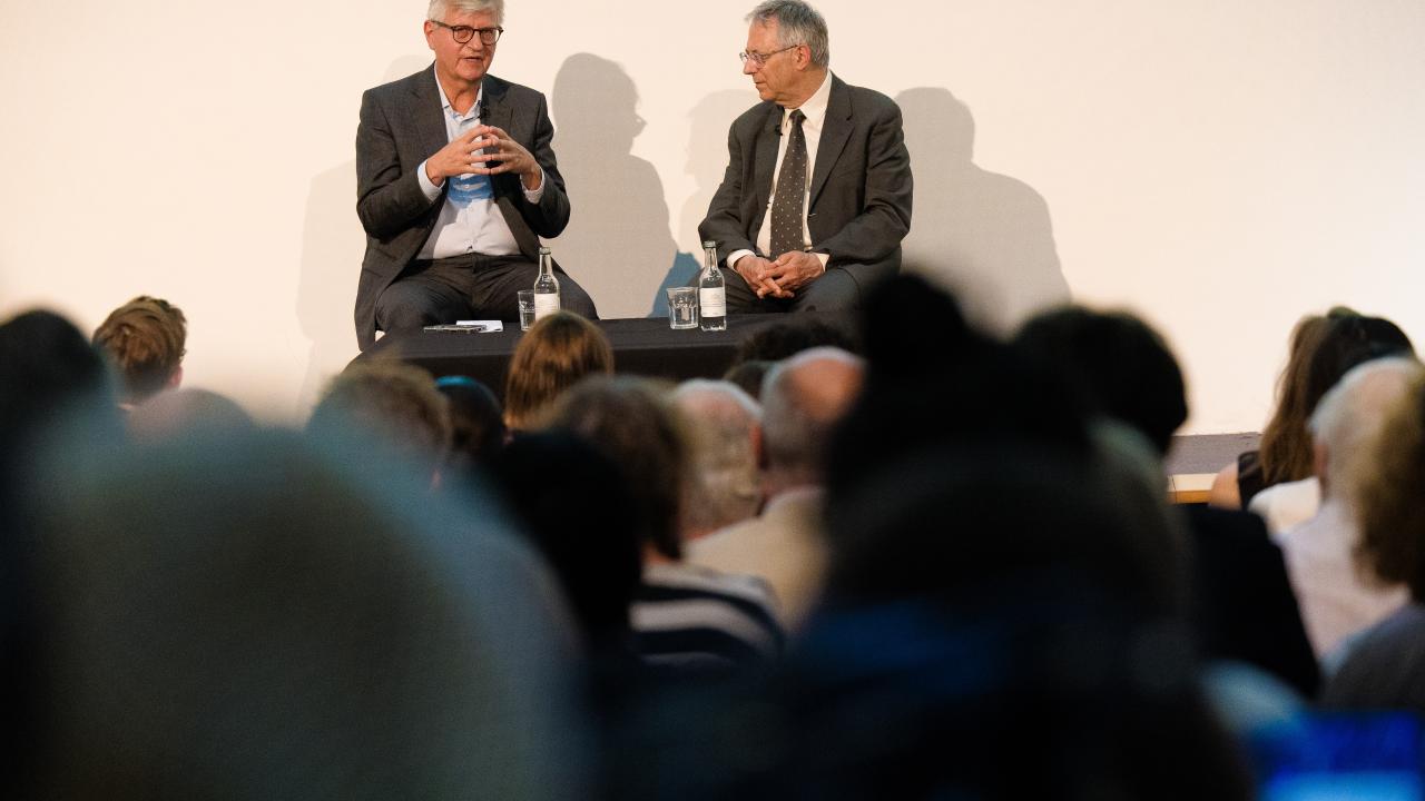 image of two people sat next to one another taking questions from an audience