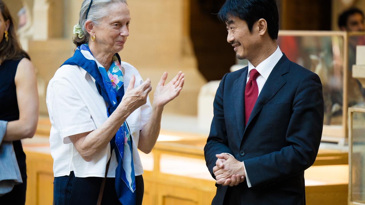 image of a man and a woman next to one another speaking