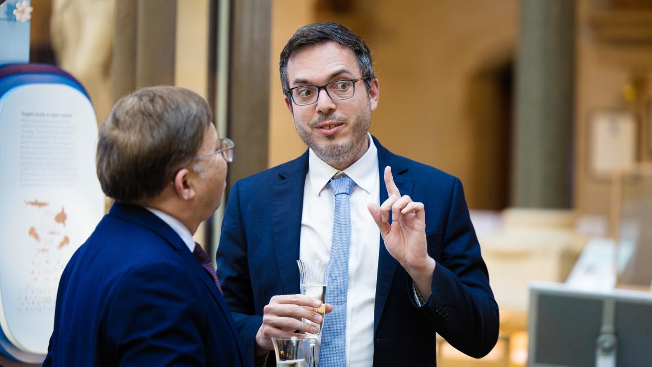 image of two men stood talking