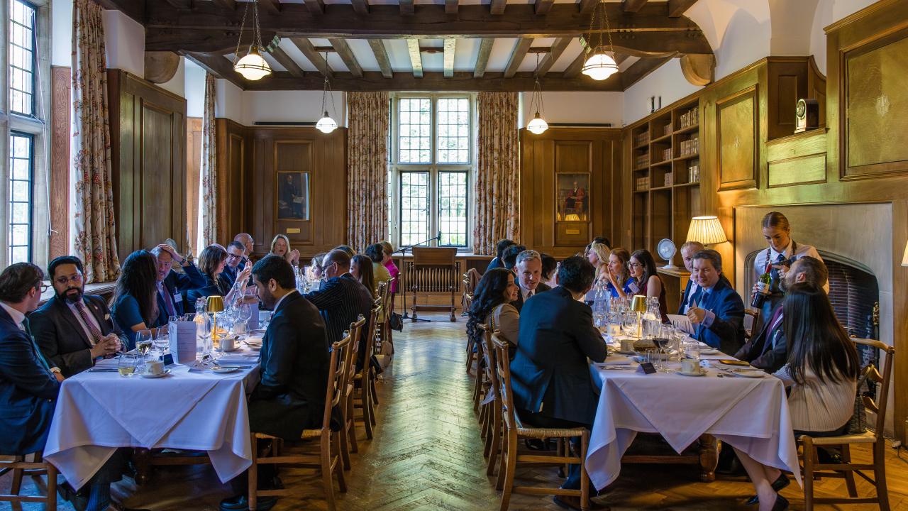 image of a room with two long tables in with people sat at both tables