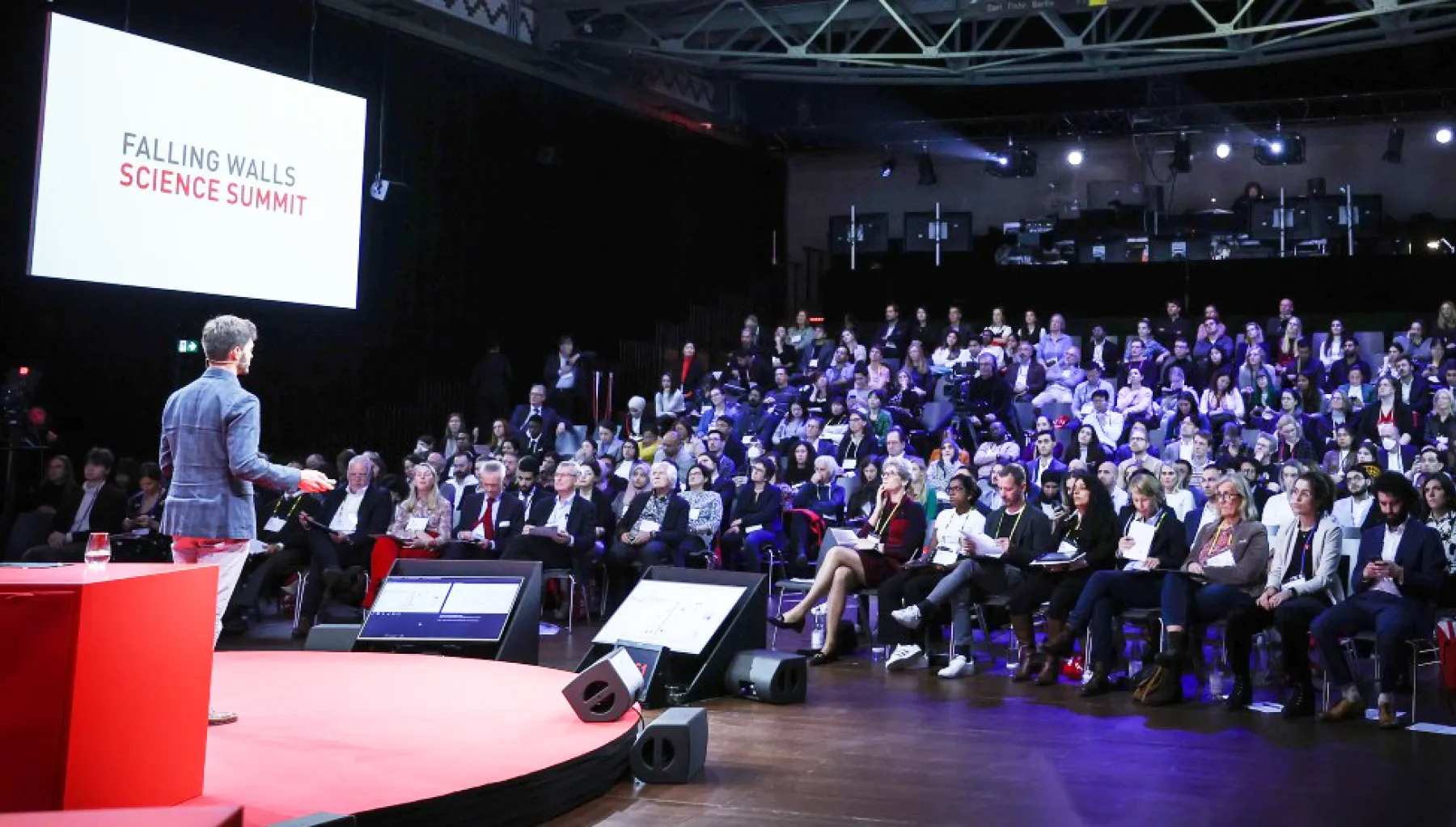 image of a man giving a lecture in front of an audience