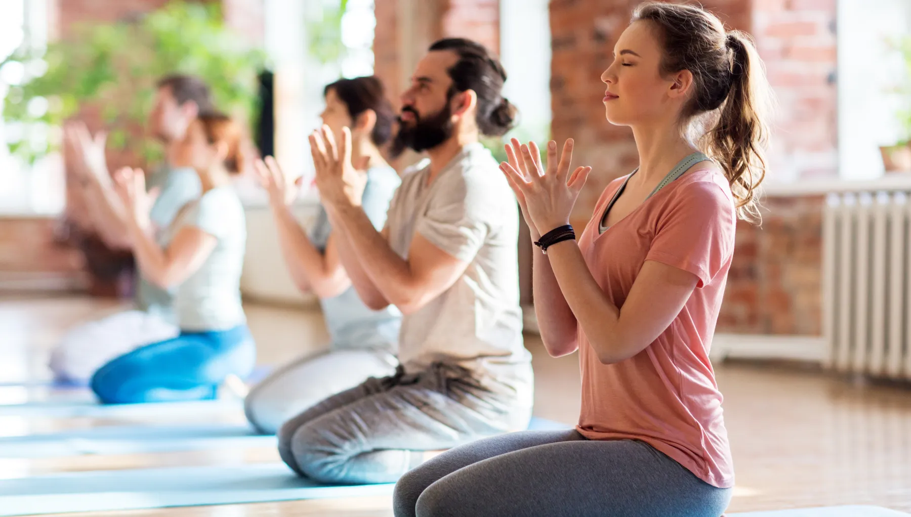 image of a group of people doing yoga