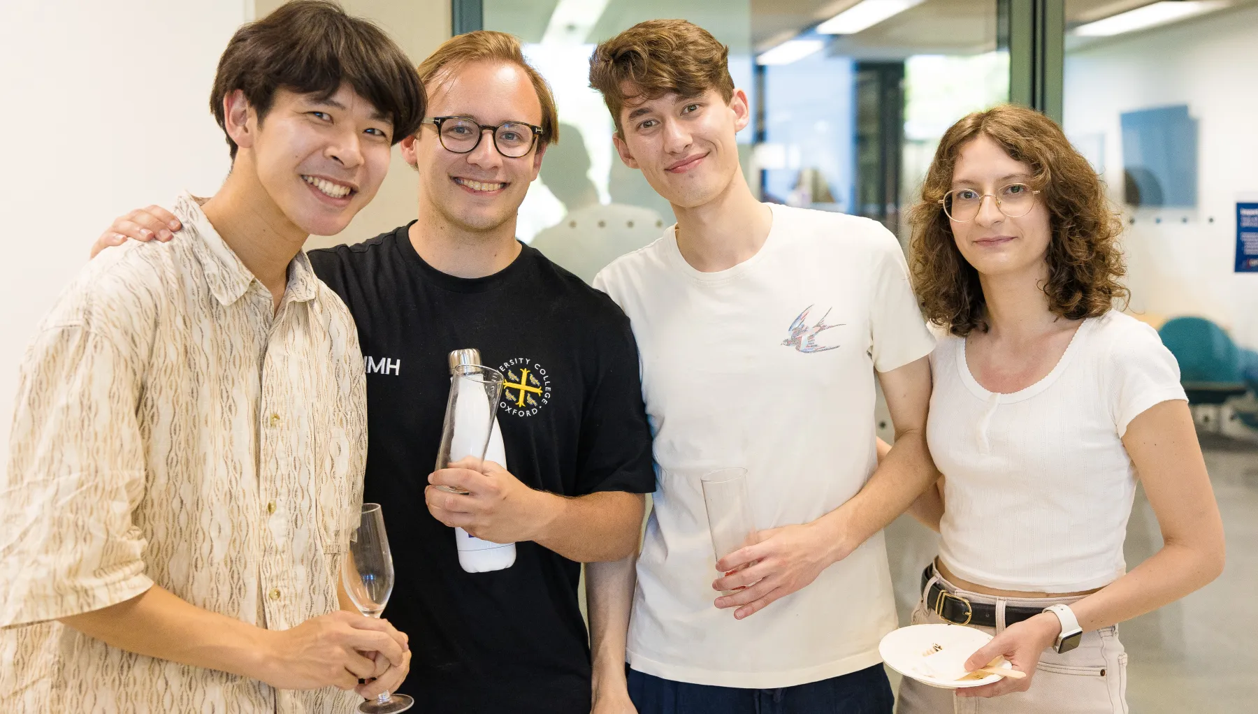 image of four students stood together