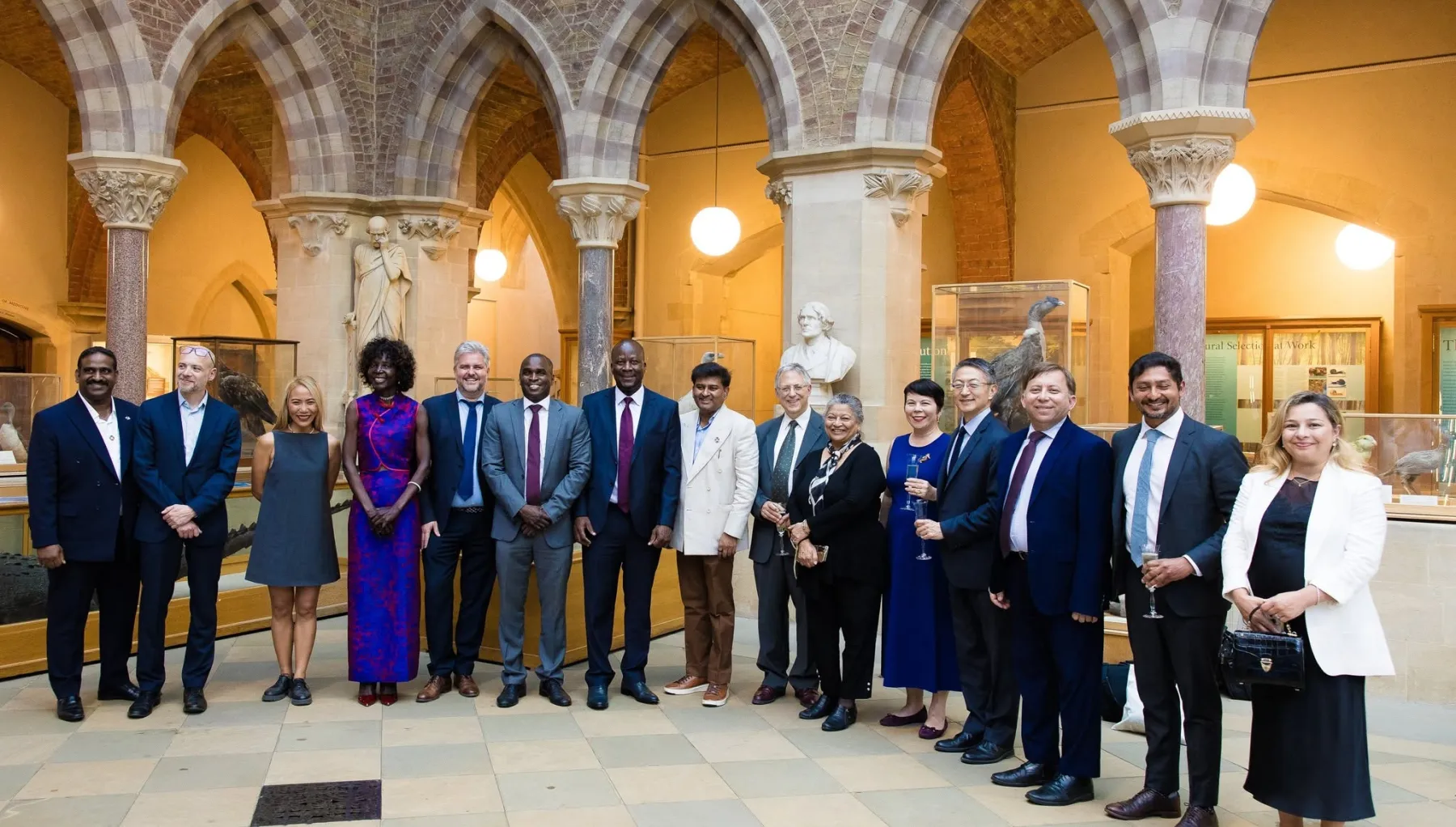 semi circle of 15 people facing the camera smiling