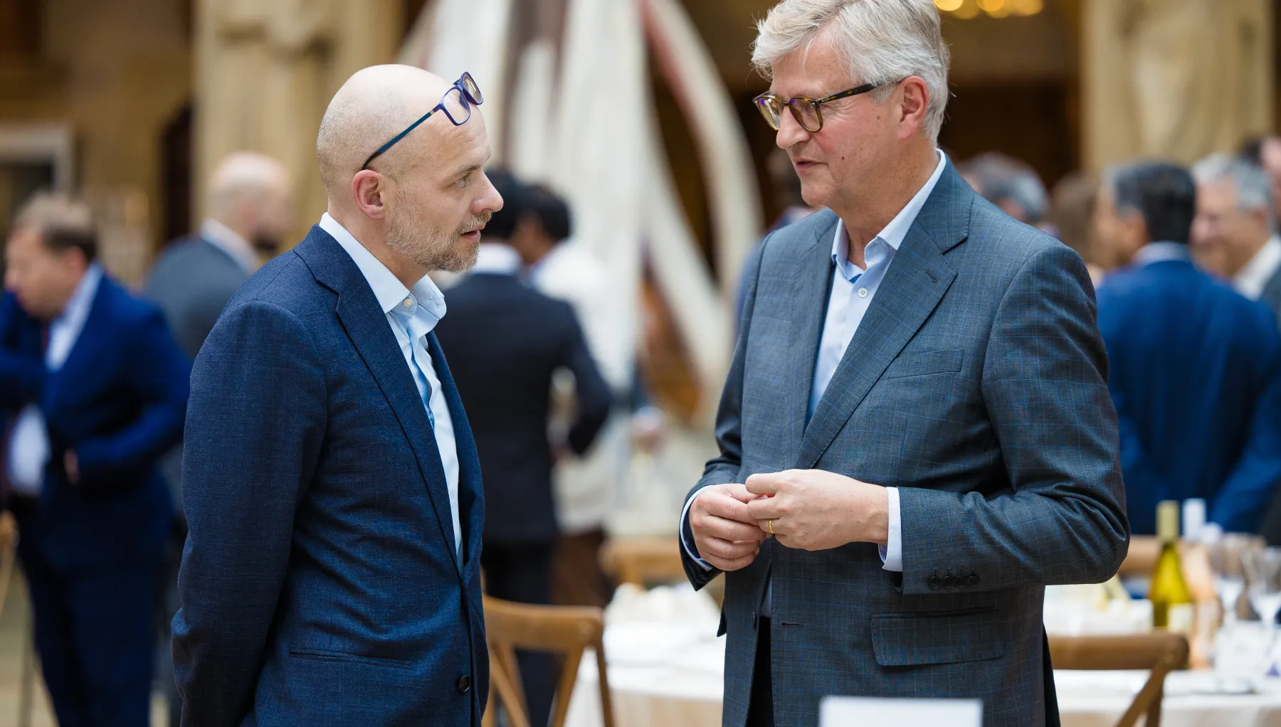 image of two men stood beside one another speaking