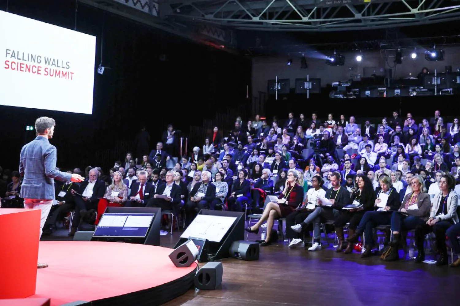 image of a man giving a lecture in front of an audience