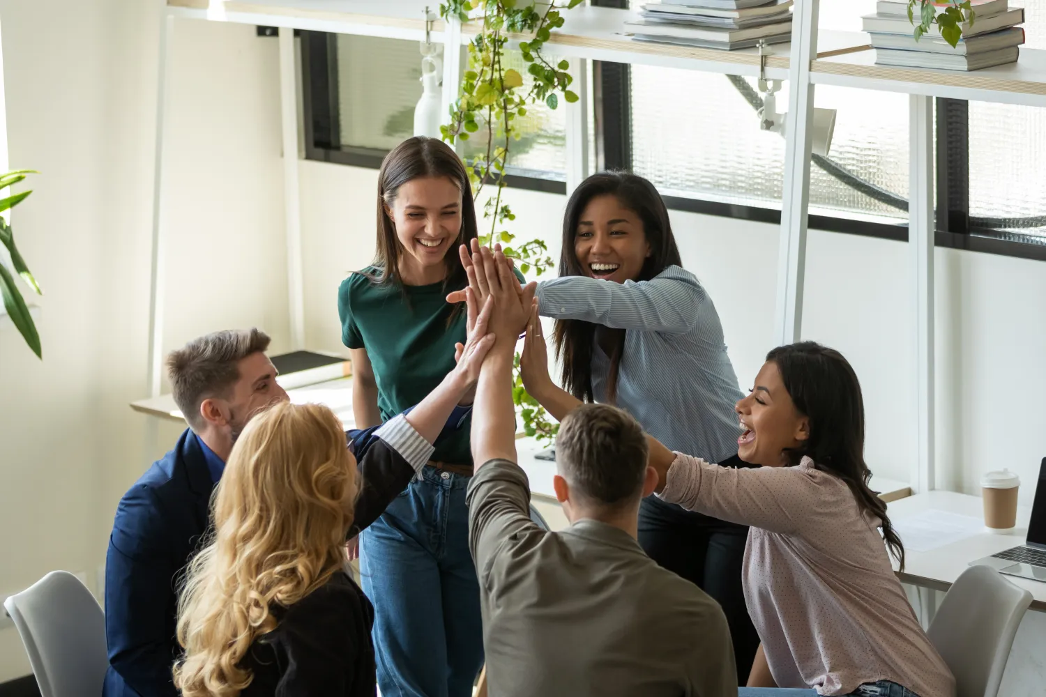 image of a group of people putting their hands together