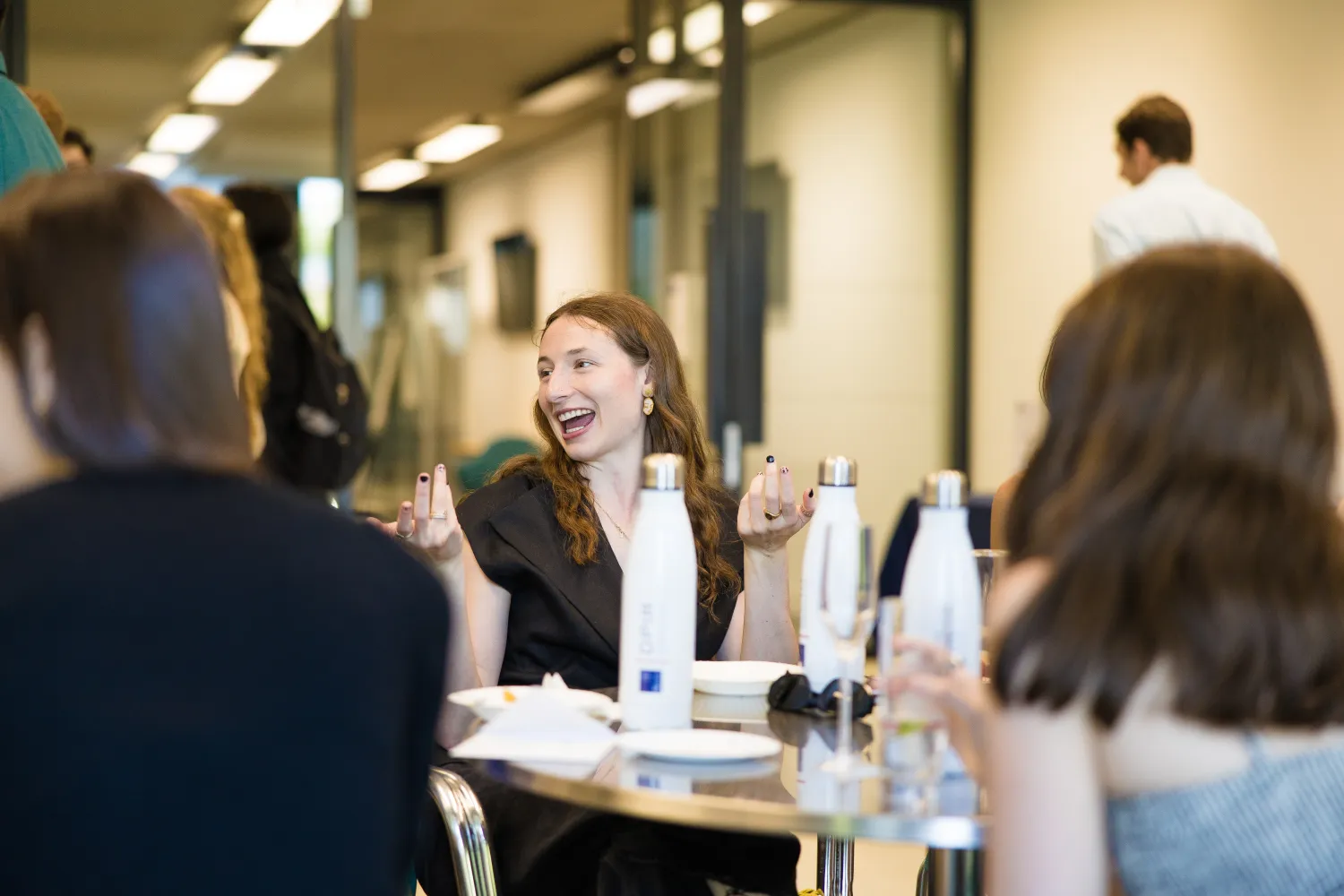 image of three students sat at a table