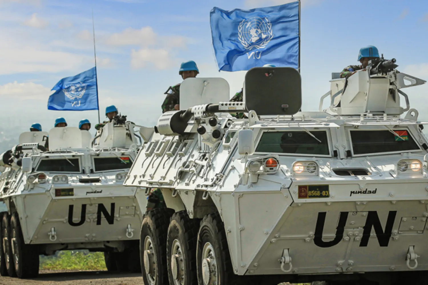 Sentul, West Java, Indonesia - May 2011 - Indonesia's UN Peacekeeper troops with two white battle tanks