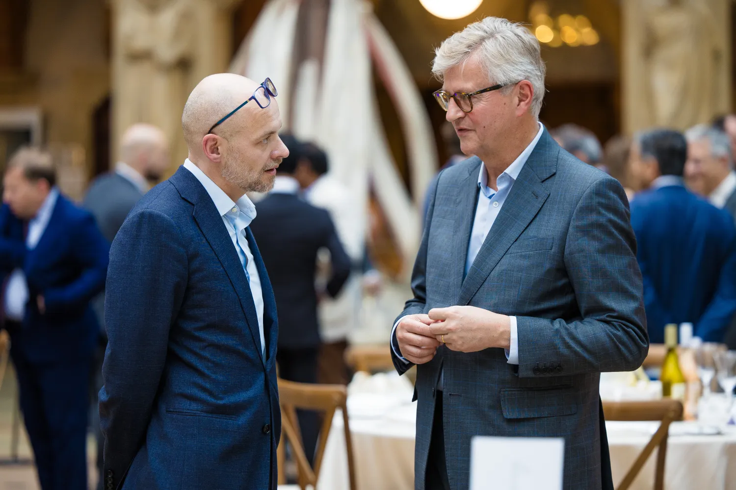 image of two men stood beside one another speaking