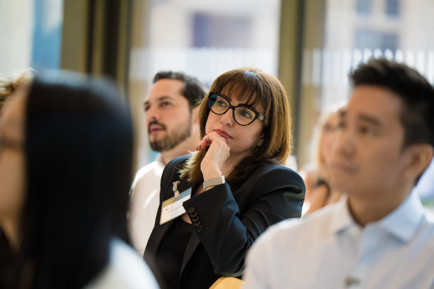 side image of an audience sat listening to a lecture
