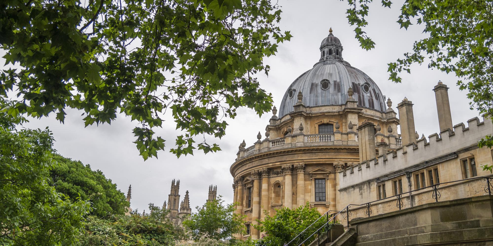 a building with a dome and trees.